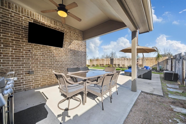 view of patio / terrace with an outdoor living space, outdoor dining area, a ceiling fan, and a fenced backyard