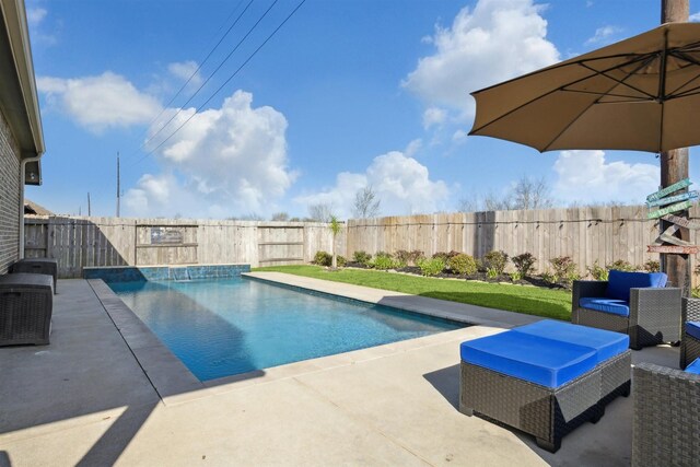 view of swimming pool with outdoor lounge area, a patio area, a fenced in pool, and a fenced backyard