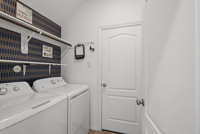 laundry area with washer and clothes dryer and laundry area