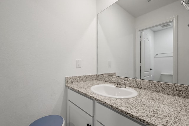 bathroom featuring vanity and visible vents