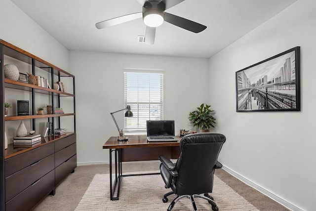 office with light carpet, baseboards, and ceiling fan