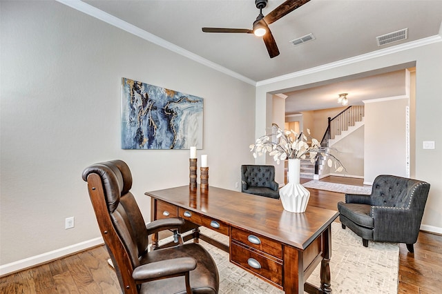 office with visible vents, crown molding, ceiling fan, and wood finished floors