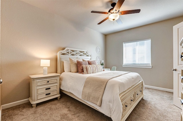 carpeted bedroom with baseboards and ceiling fan