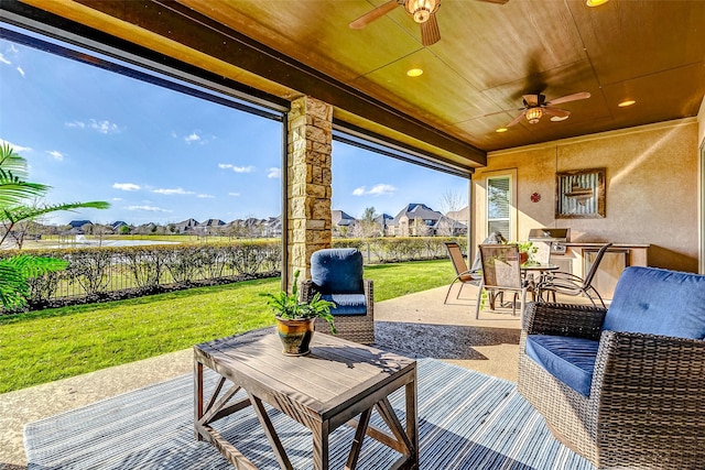 view of patio / terrace featuring outdoor dining space, an outdoor living space, and a ceiling fan