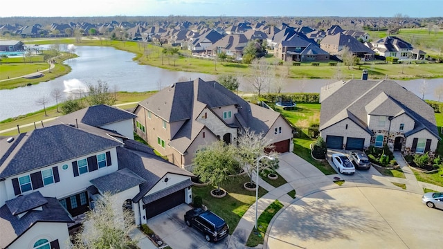 aerial view featuring a residential view and a water view