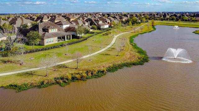 drone / aerial view with a residential view and a water view