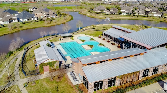 bird's eye view featuring a residential view and a water view