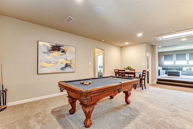 playroom featuring visible vents, baseboards, light carpet, recessed lighting, and arched walkways