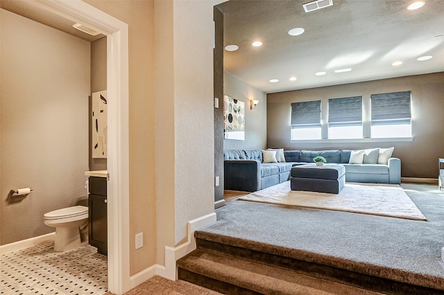 bathroom with recessed lighting, toilet, baseboards, and visible vents