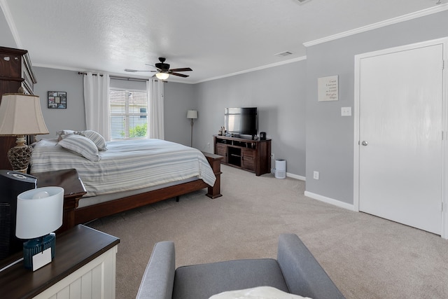 bedroom with visible vents, ceiling fan, baseboards, light colored carpet, and ornamental molding