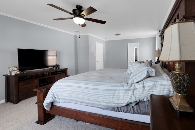 bedroom featuring ceiling fan, light colored carpet, and ornamental molding