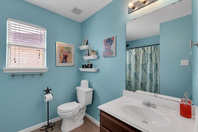 bathroom featuring visible vents, toilet, tile patterned flooring, baseboards, and vanity