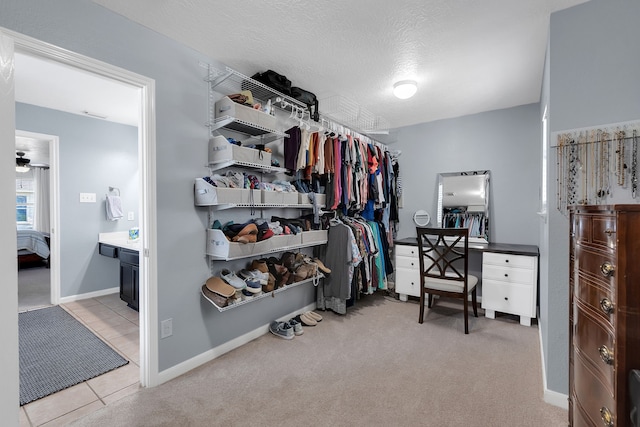 walk in closet featuring carpet flooring