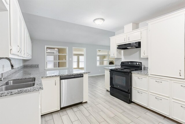 kitchen featuring black range with electric stovetop, a sink, under cabinet range hood, stainless steel dishwasher, and white cabinetry