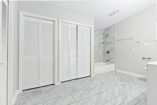 full bath featuring baseboards, bathing tub / shower combination, a closet, marble finish floor, and vanity