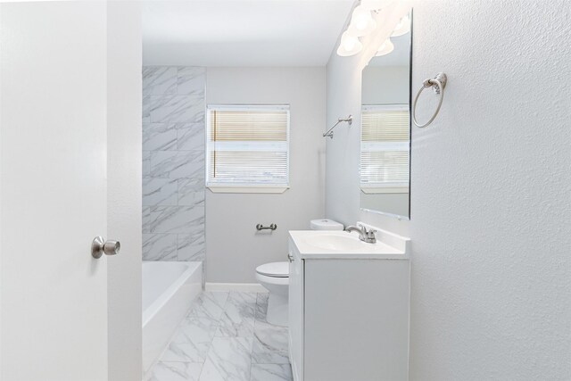 full bath with vanity, toilet, baseboards, and marble finish floor