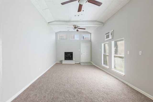 unfurnished living room with an AC wall unit, a fireplace with raised hearth, light colored carpet, and baseboards