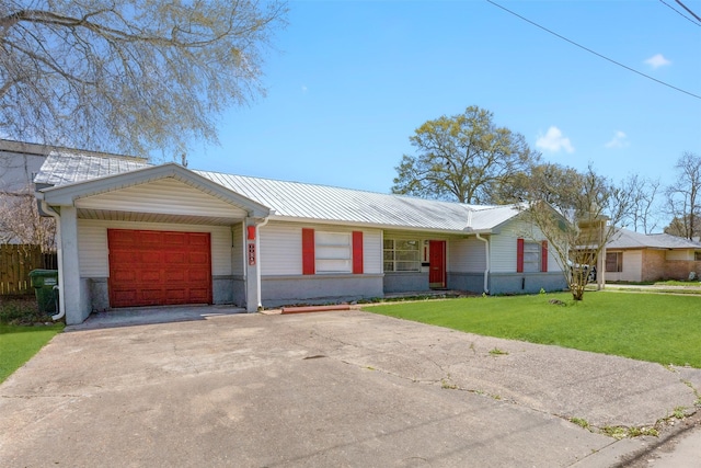 single story home featuring driveway, a front yard, a garage, and metal roof