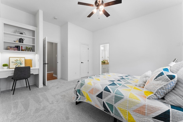 carpeted bedroom with baseboards, ensuite bath, and ceiling fan