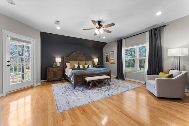 bedroom featuring visible vents, baseboards, access to exterior, and light wood finished floors