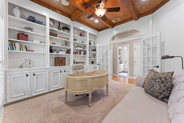 living area with beam ceiling, wood ceiling, and ceiling fan