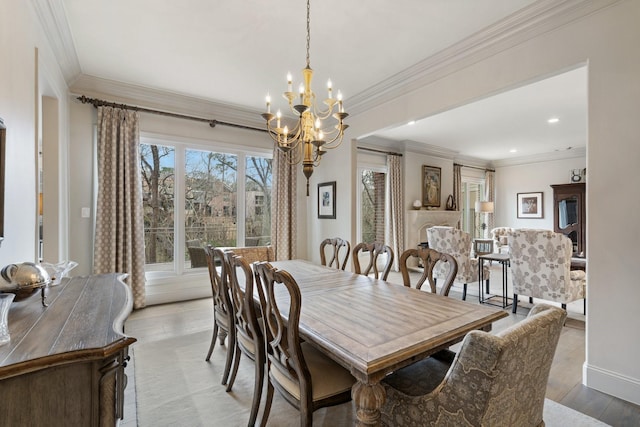 dining space featuring baseboards, light wood finished floors, an inviting chandelier, recessed lighting, and crown molding