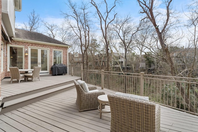 wooden deck with grilling area