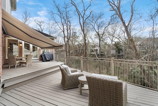 wooden deck with area for grilling