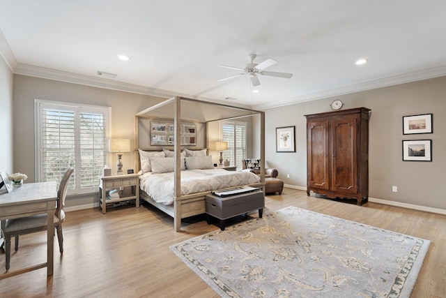 bedroom featuring visible vents, multiple windows, and ornamental molding