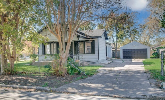 view of front facade with a garage, an outdoor structure, and fence