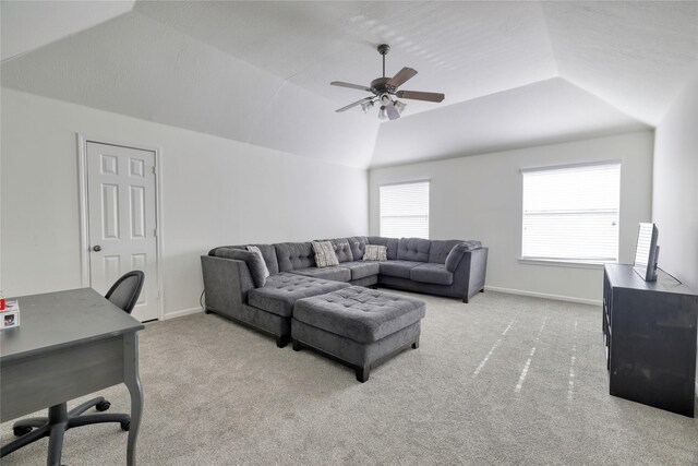 living room featuring lofted ceiling, carpet flooring, and baseboards