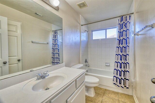 full bath with visible vents, toilet, vanity, and shower / bathtub combination with curtain