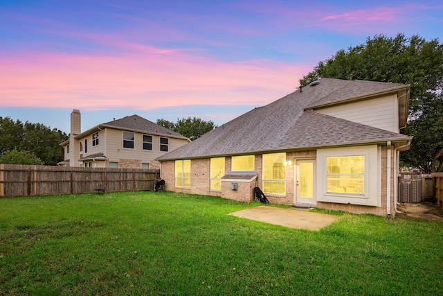 17614 Wind Mist Ln, Cypress, TX 77433 - back of property with a patio, roof with shingles, and brick siding