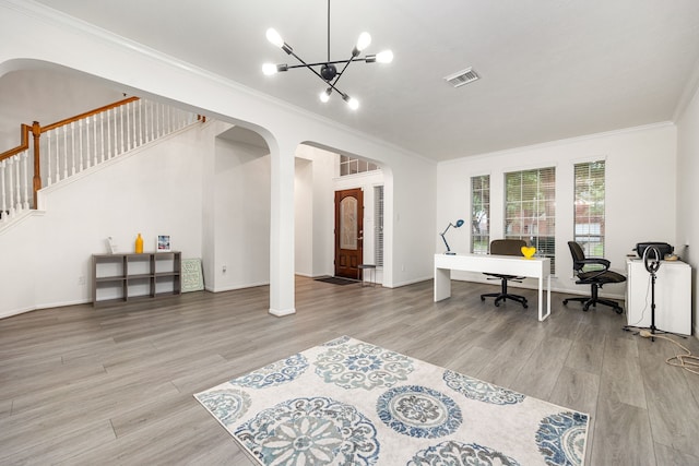 17614 Wind Mist Ln, Cypress, TX 77433 - office area with arched walkways, crown molding, a chandelier, wood finished floors, and baseboards