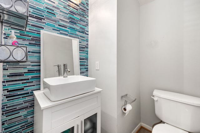 17614 Wind Mist Ln, Cypress, TX 77433 - bathroom featuring toilet, vanity, and baseboards