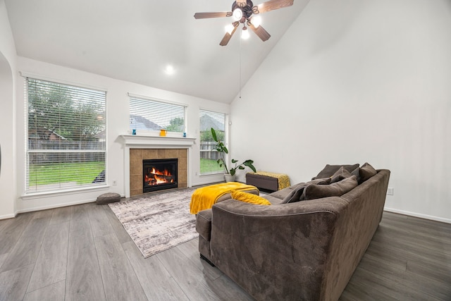 17614 Wind Mist Ln, Cypress, TX 77433 - living room with ceiling fan, plenty of natural light, wood finished floors, high vaulted ceiling, and a fireplace