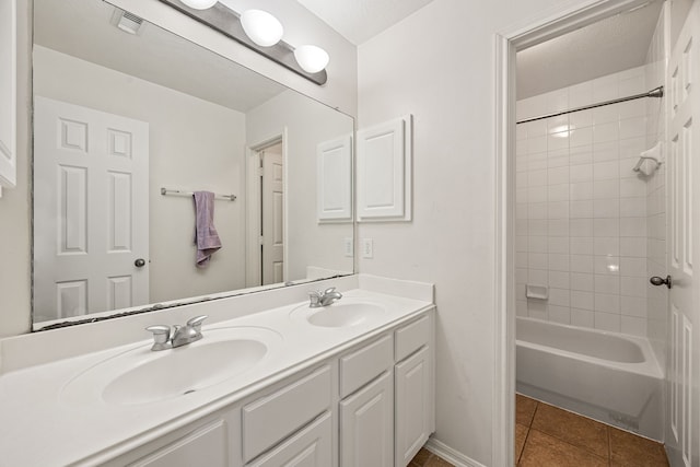 17614 Wind Mist Ln, Cypress, TX 77433 - bathroom with double vanity, tile patterned floors, and  shower combination