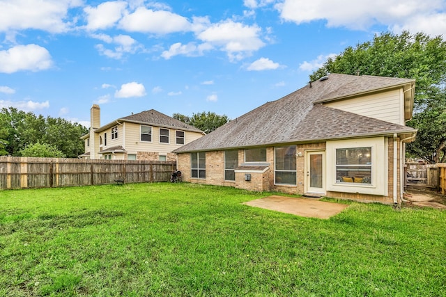 17614 Wind Mist Ln, Cypress, TX 77433 - rear view of property with roof with shingles, a patio area, and brick siding