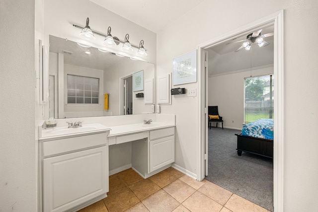 17614 Wind Mist Ln, Cypress, TX 77433 - ensuite bathroom featuring double vanity, ceiling fan, baseboards, and tile patterned floors