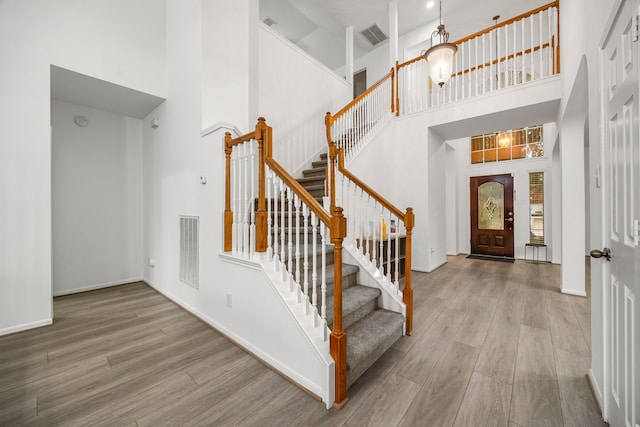 17614 Wind Mist Ln, Cypress, TX 77433 - foyer with a high ceiling, wood finished floors, stairs, and baseboards