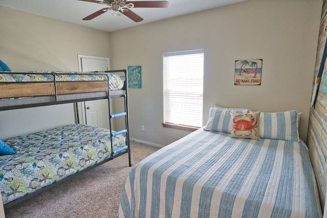 carpeted bedroom with baseboards