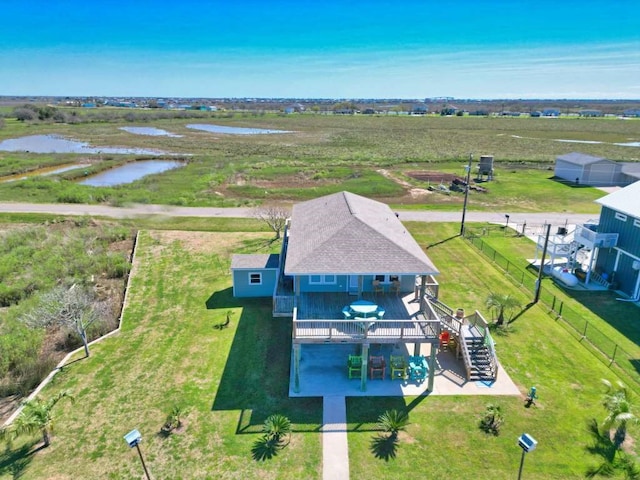 drone / aerial view featuring a rural view and a water view