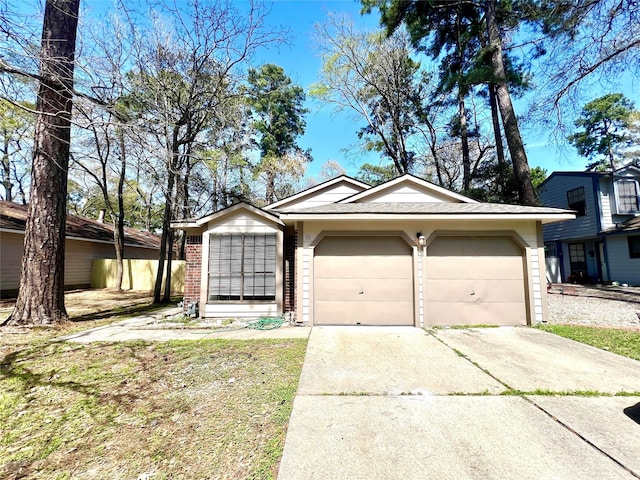 view of front of home with an attached garage and concrete driveway