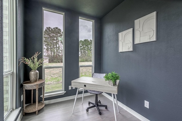 office with baseboards and wood finished floors