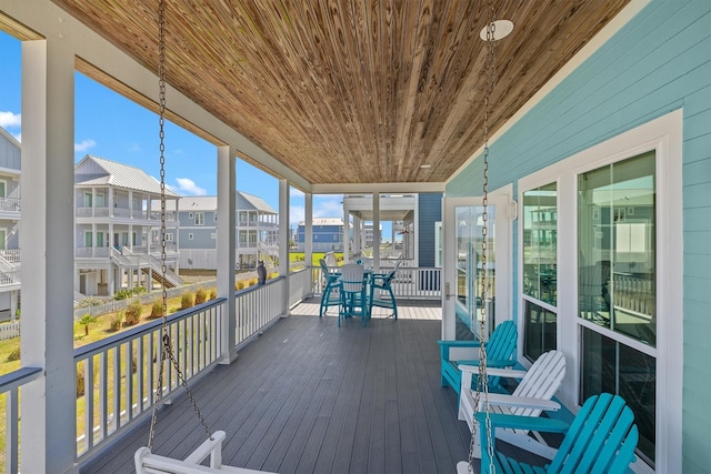 wooden deck with a residential view