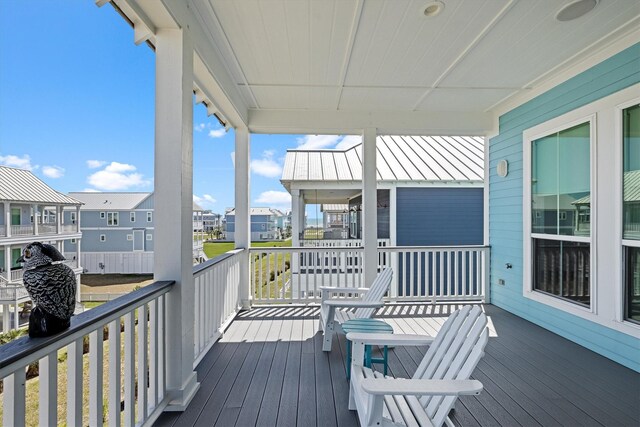 wooden deck featuring a residential view