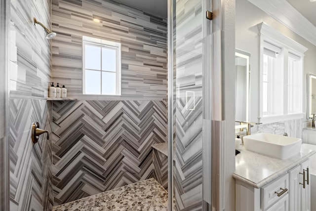 full bathroom featuring vanity and a tile shower