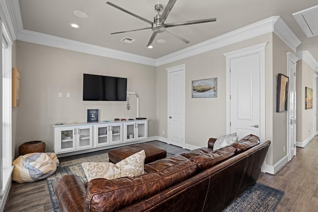 living area featuring visible vents, ornamental molding, ceiling fan, and wood finished floors