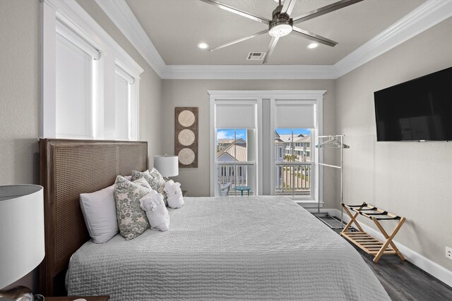 bedroom featuring visible vents, dark wood-type flooring, baseboards, ornamental molding, and access to outside