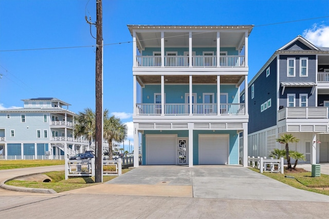 beach home with a garage and driveway